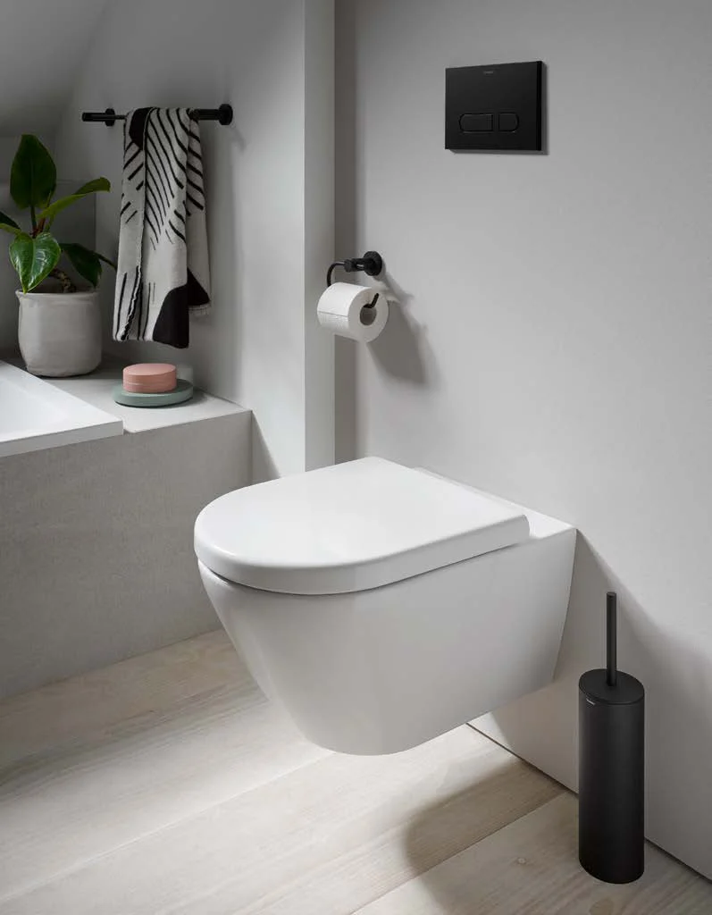 Toilet zone with black actuator plate and accessories