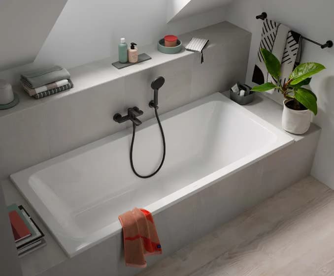 Bathtub with black tub faucet
