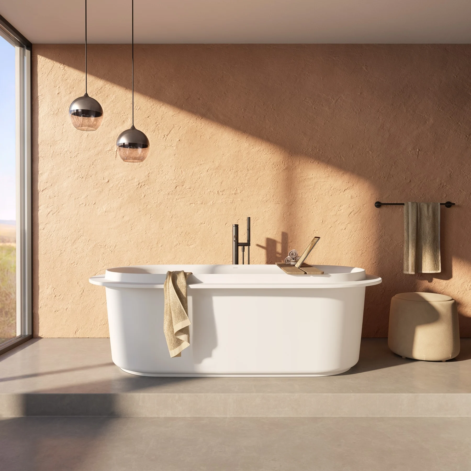 Freestanding bathtub in front of a window with a forest view