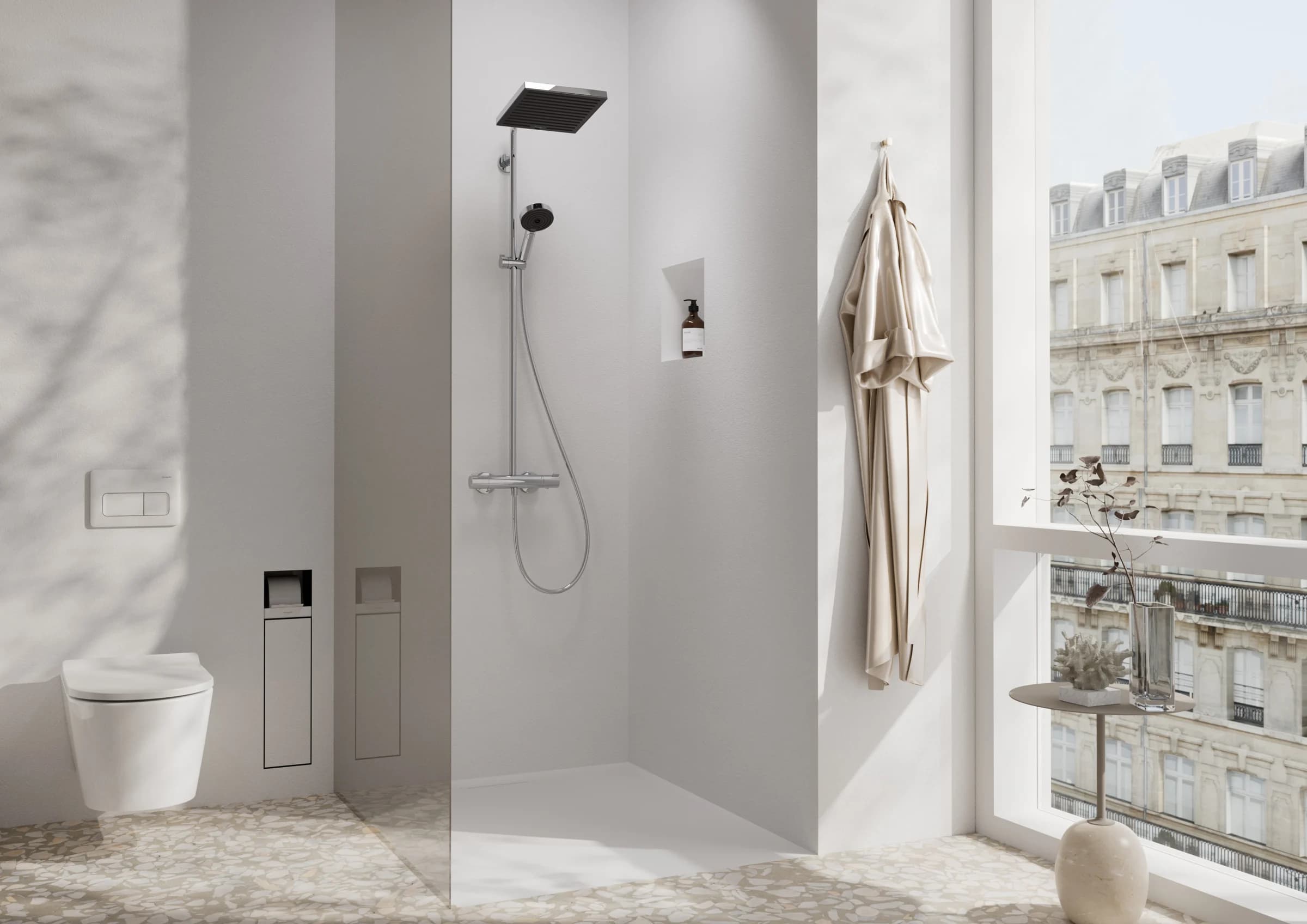 Bright shower bathroom with a black overhead shower and a city window