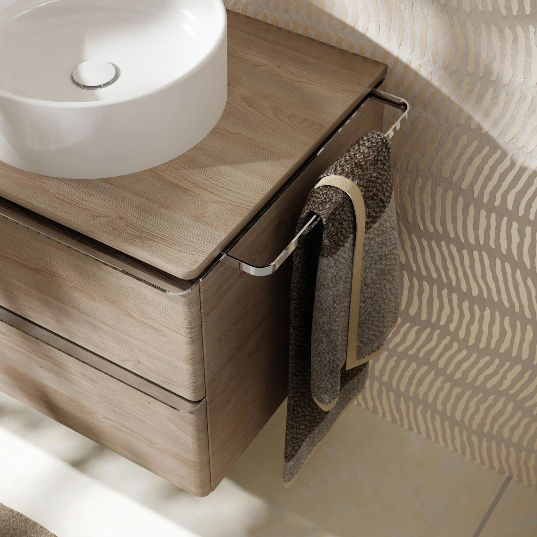 Round basin on a wooden vanity with a towel rail