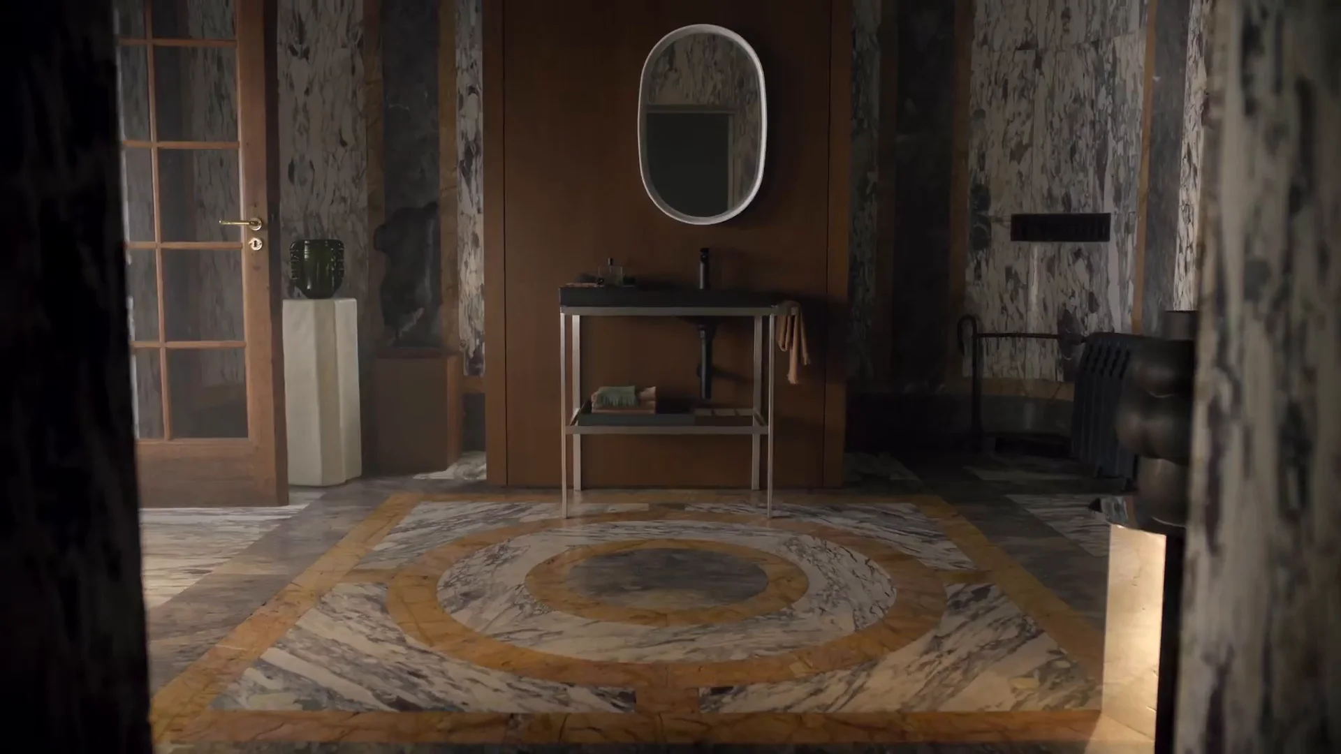 Aurena bathroom with marble walls and a slim console washstand