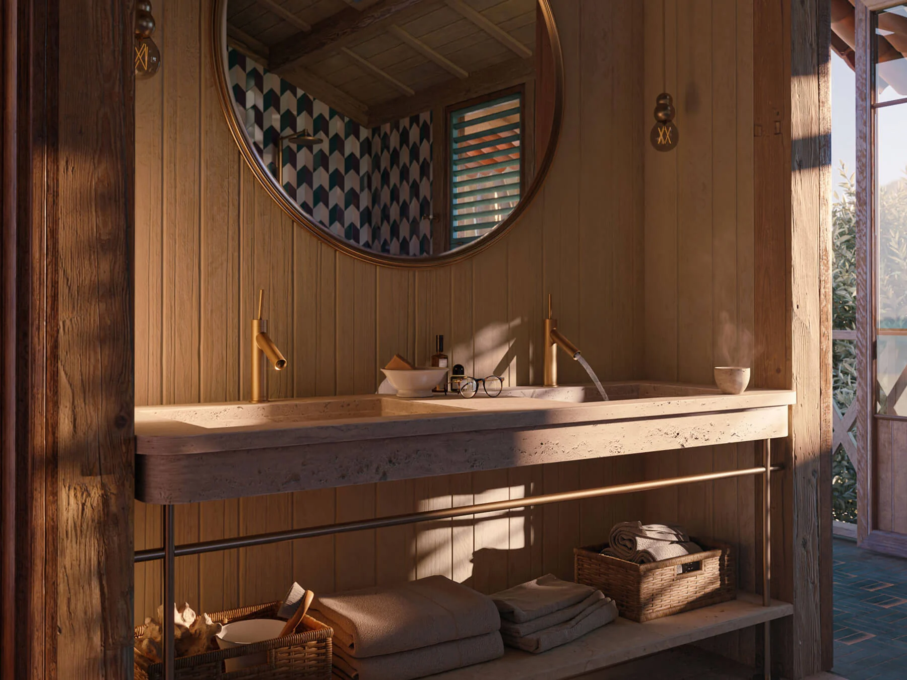 Travertine double washbasin with warm brass fittings in a wood-panelled bathroom with a round mirror