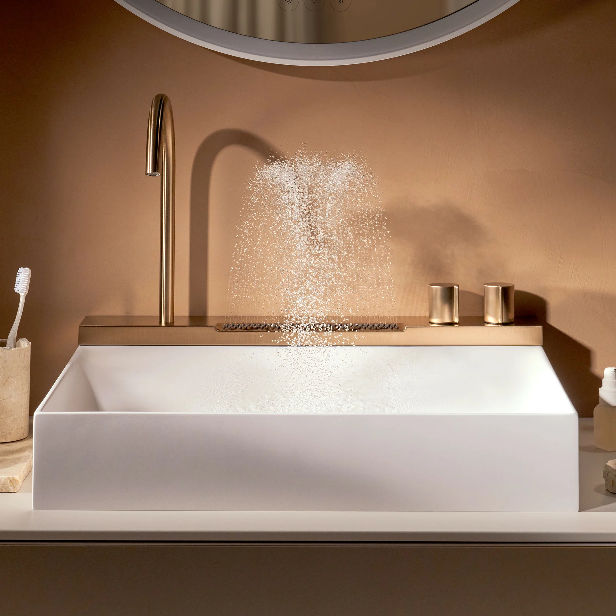 Bronze fountain mixer filling a white basin