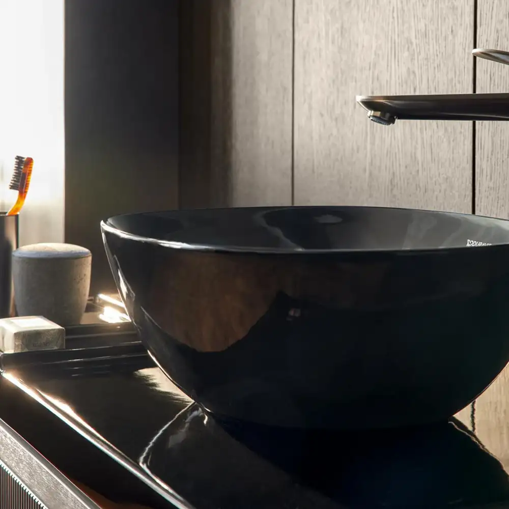 Black countertop bowl on a dark surface