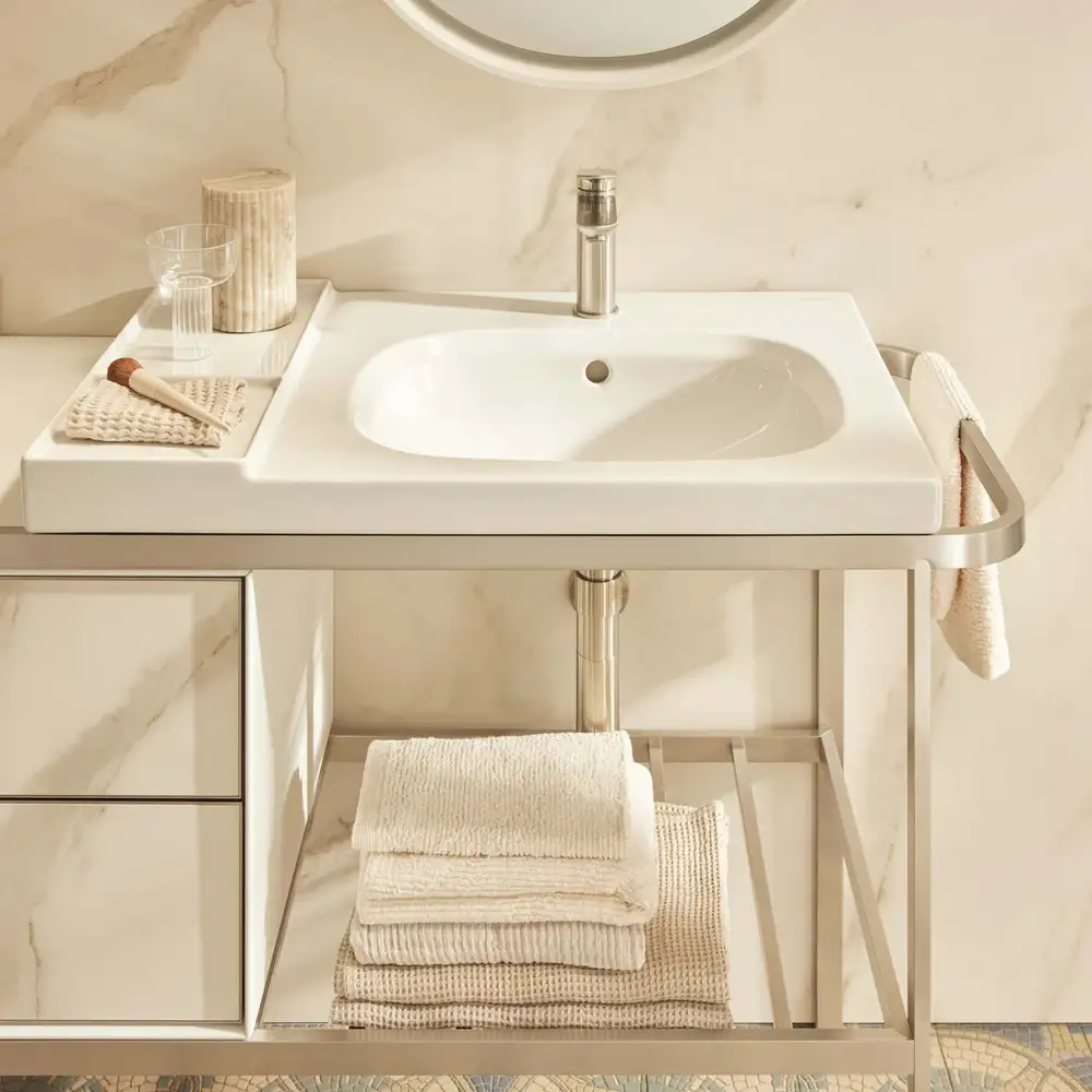 White washbasin on a slim metal console