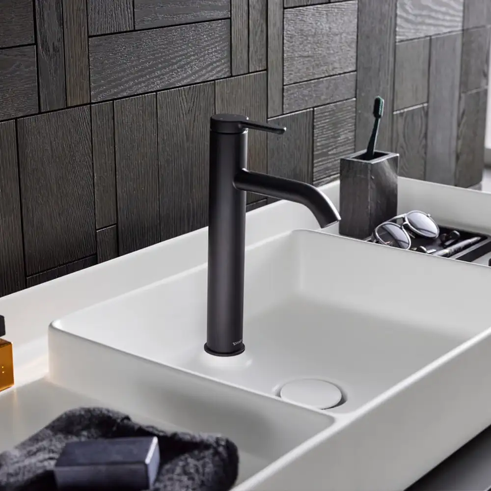 Rectangular white basin with a matt black mixer