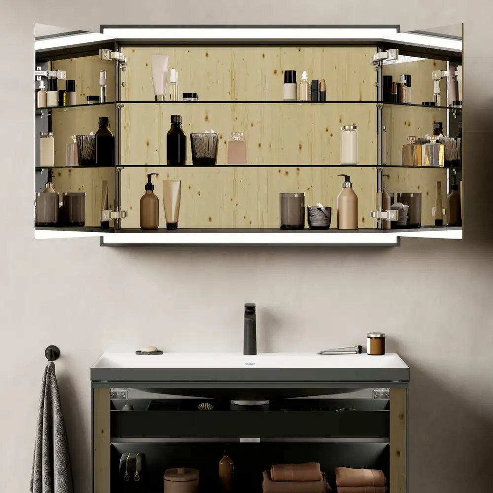 Vitrium mirror cabinet with lit glass shelves above a slim vanity