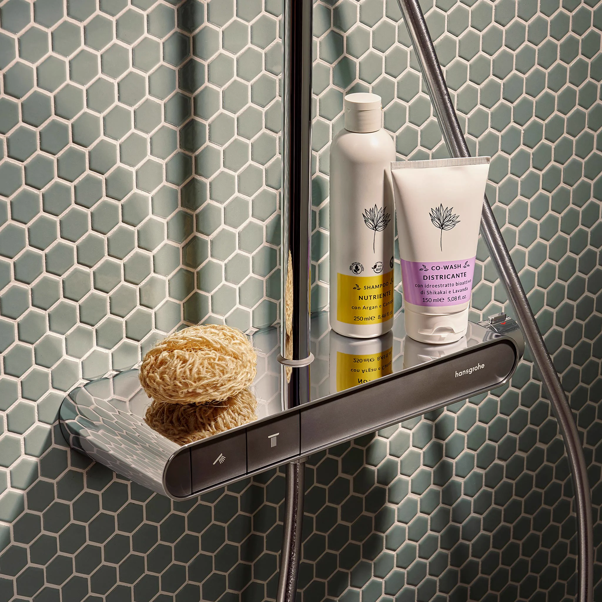 Thermostat shelf of a hansgrohe shower system on green mosaic