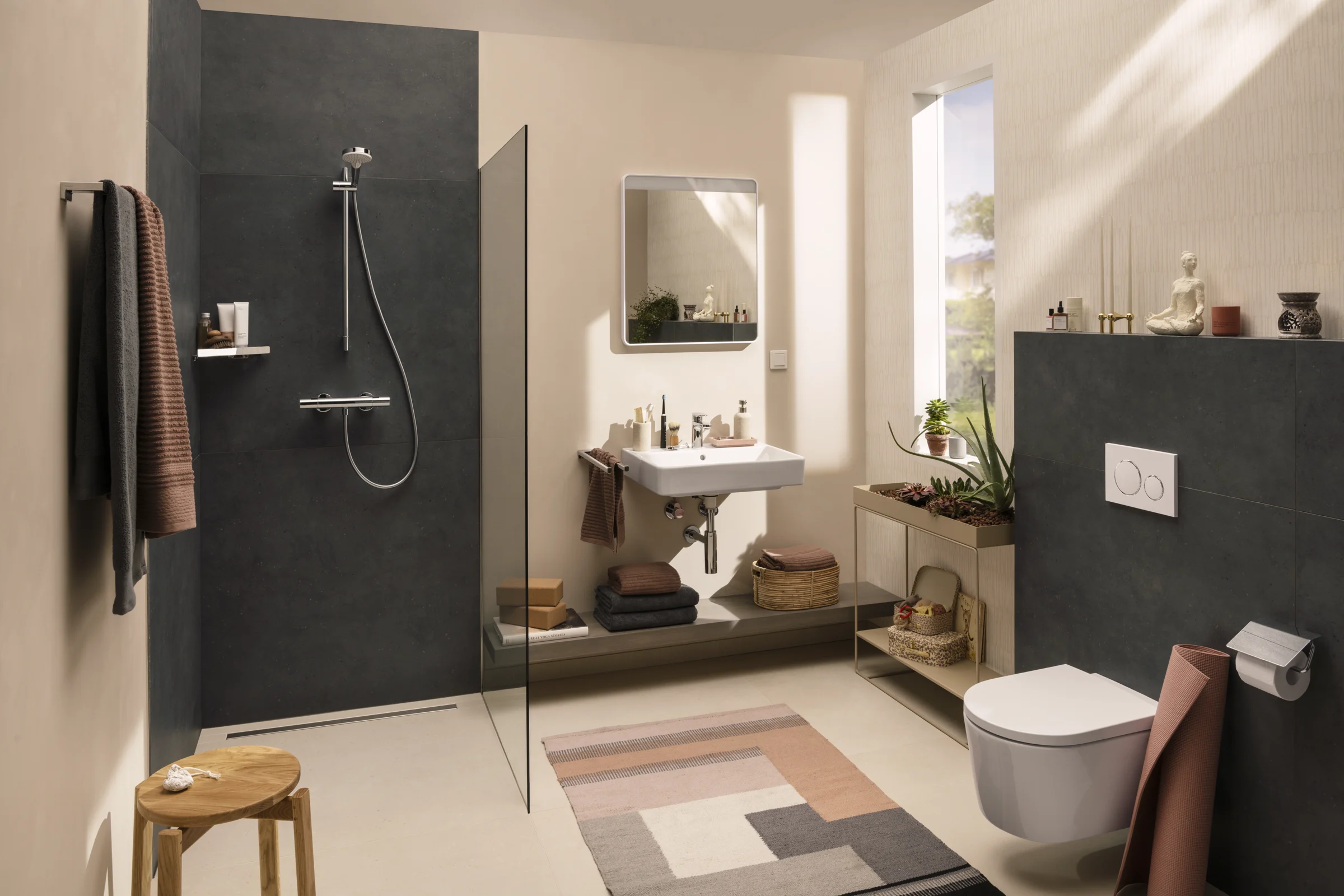 Anthracite slate walk-in shower behind a frameless glass panel