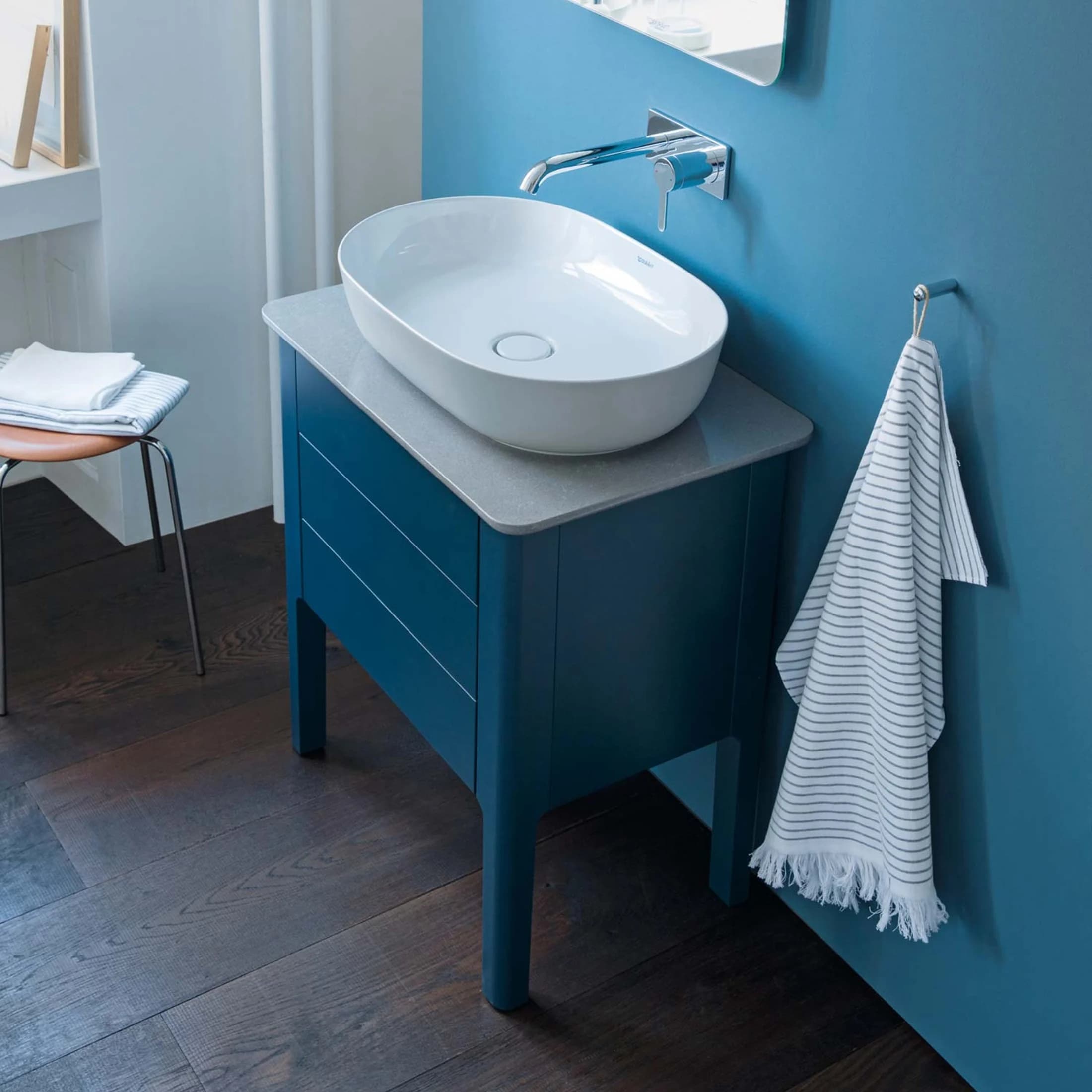 Luv bathroom in cool grey with a natural-stone console
