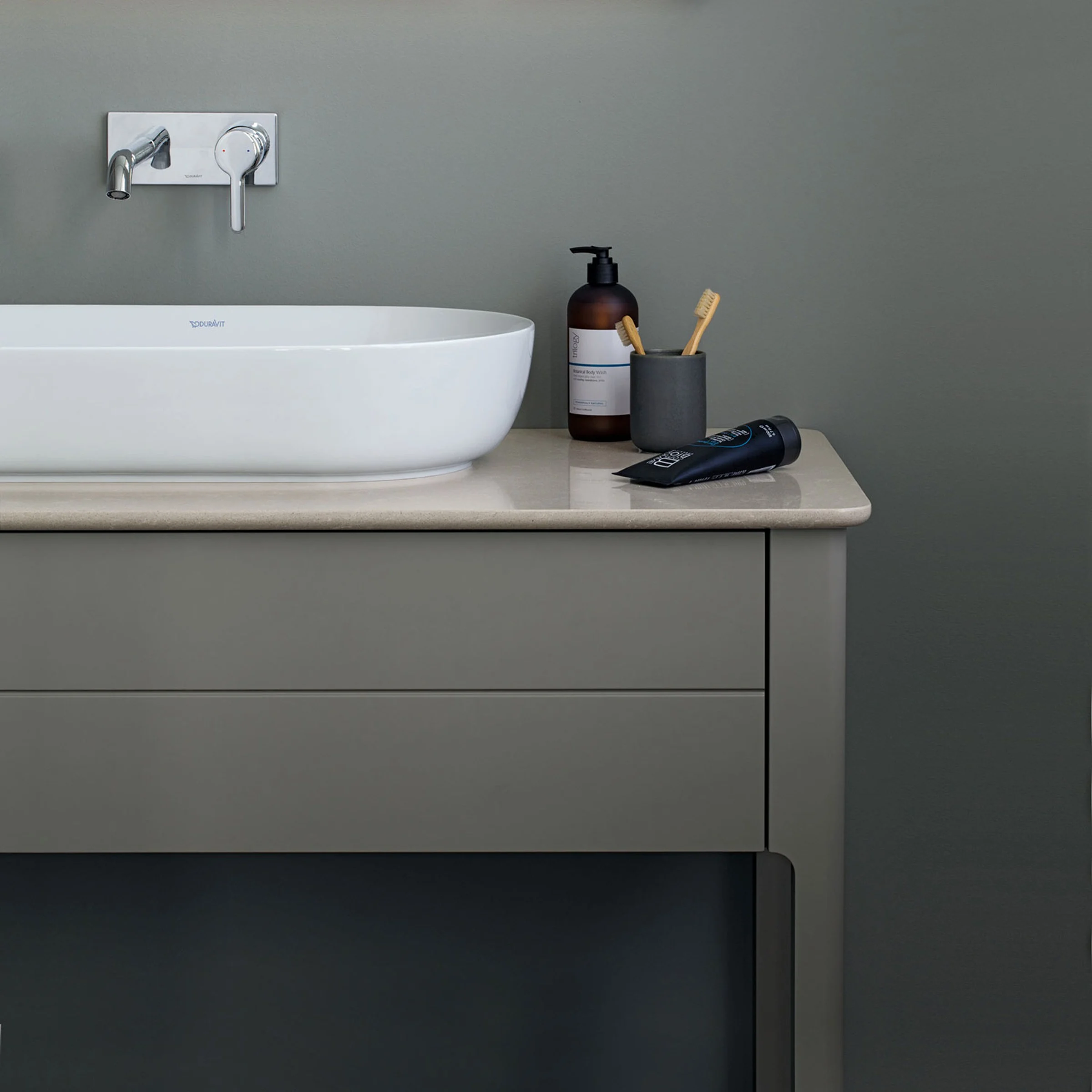 Luv bathroom in cool grey with a natural-stone console