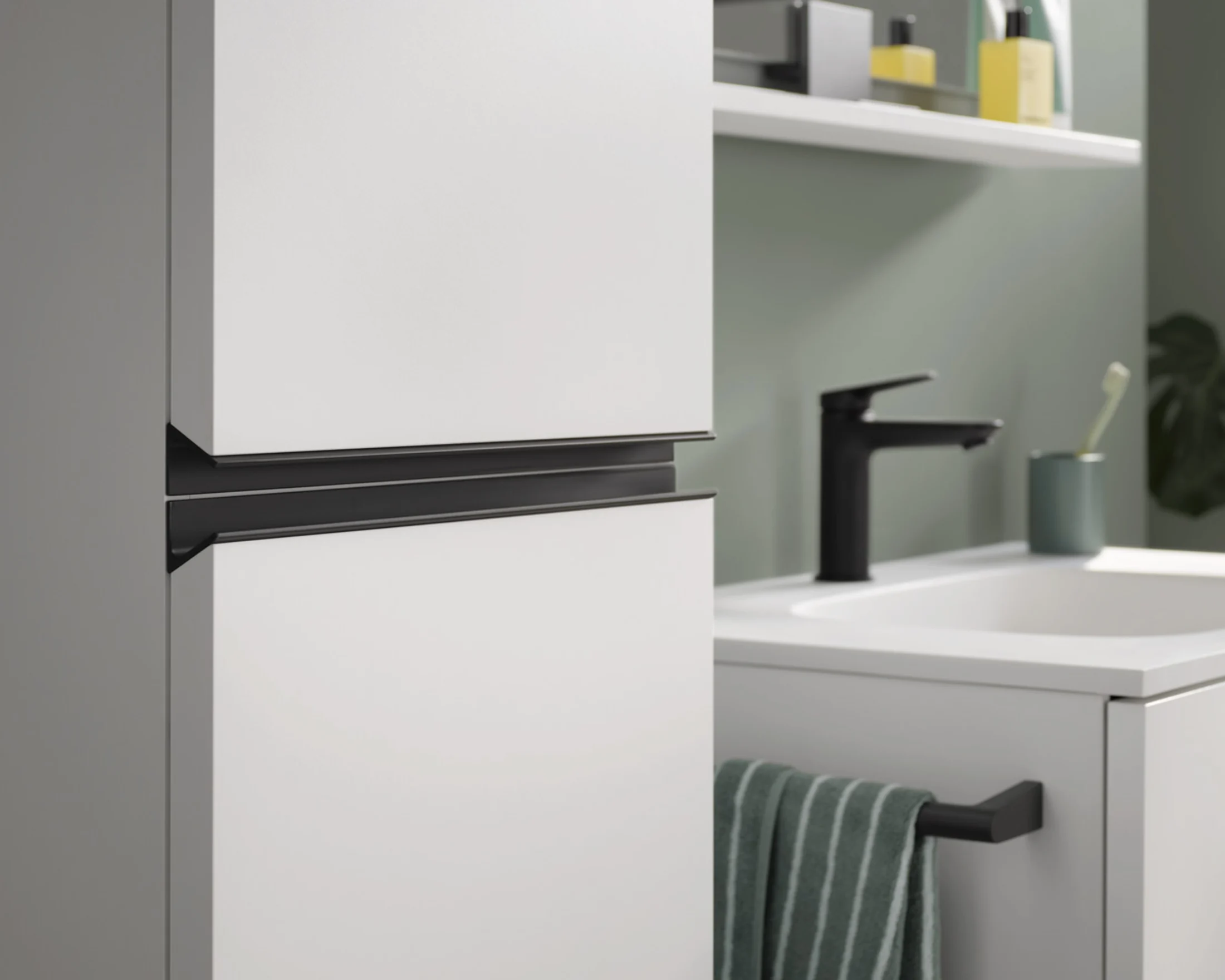 Sivida tall cabinet with a black grip rail beside a sage green washplace